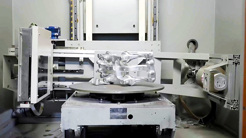 X-ray inspection bay with an aluminum control arm inside the chamber